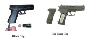 A black glock and an olive Sig Saur pistol with tags.